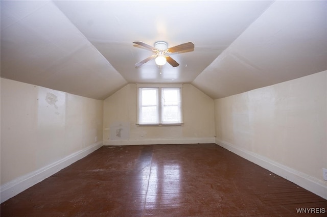 bonus room with lofted ceiling, baseboards, and a ceiling fan