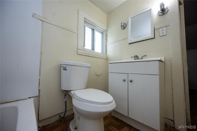 bathroom with toilet and vanity