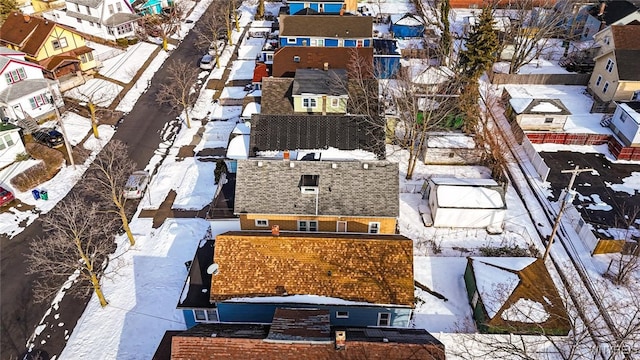 snowy aerial view featuring a residential view