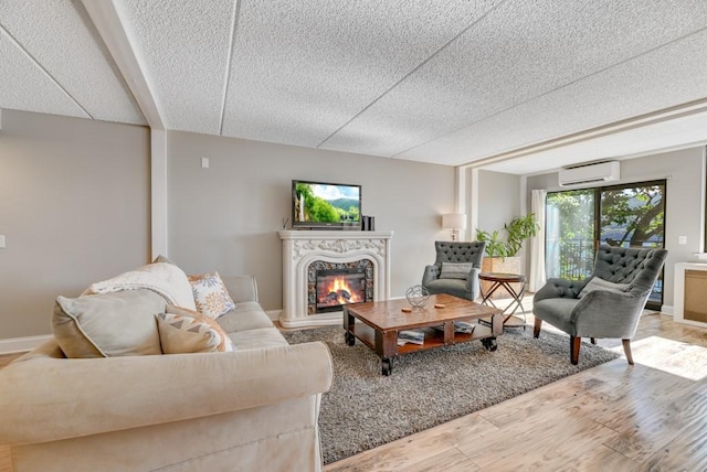 7 Cliffside Dr, South Bristol, NY 14424 - living room with hardwood / wood-style floors, a textured ceiling, and a wall mounted AC