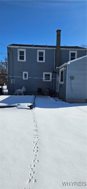 view of snow covered property