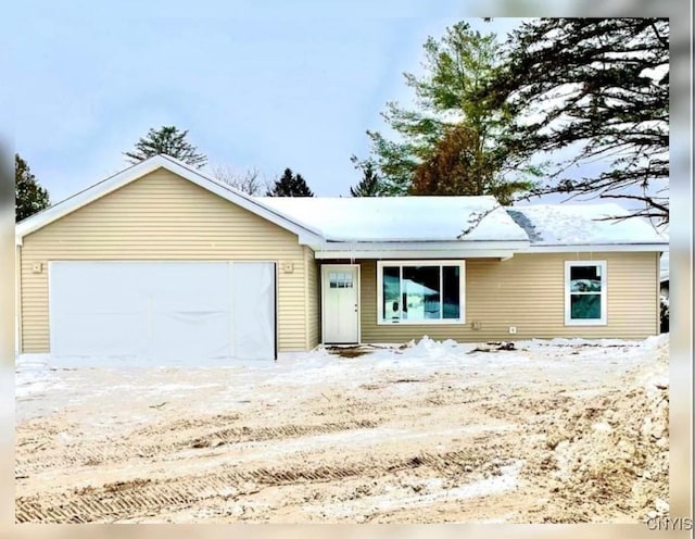 ranch-style home featuring a garage