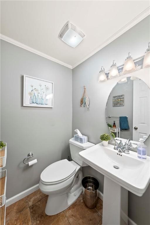 bathroom with crown molding, tile patterned floors, and toilet