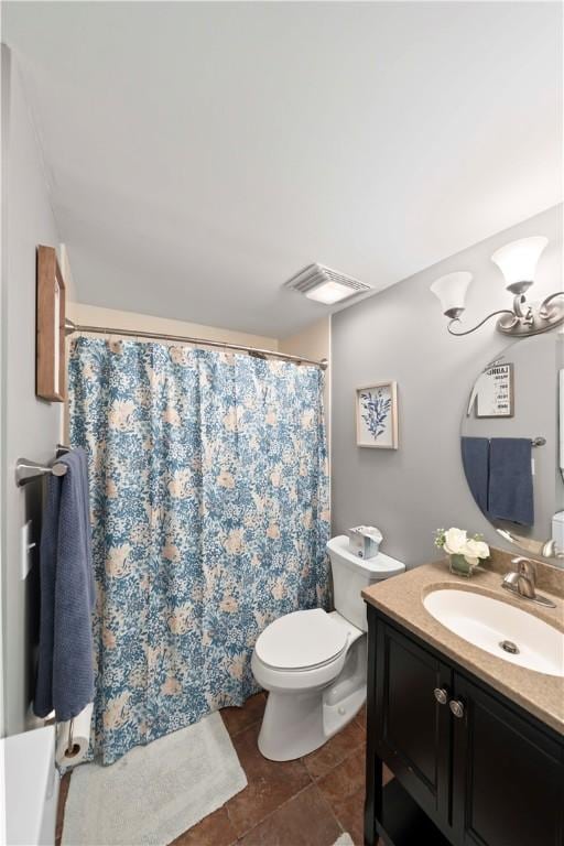 bathroom featuring vanity, a notable chandelier, and toilet