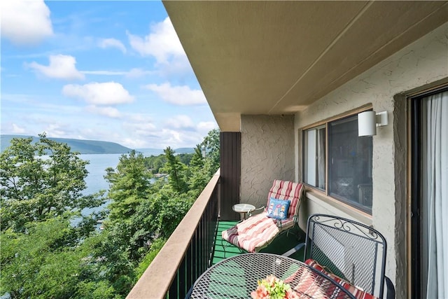 balcony with a water and mountain view