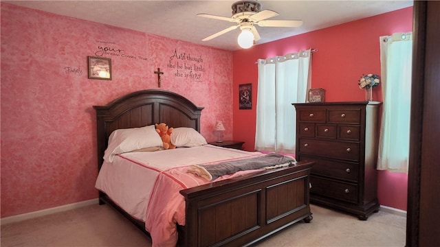 bedroom featuring light colored carpet and ceiling fan