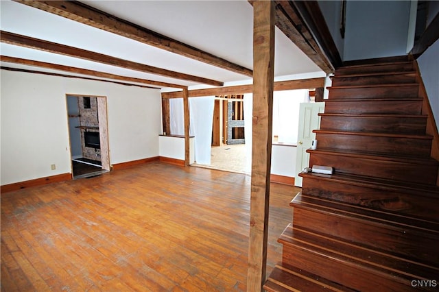 basement with hardwood / wood-style floors