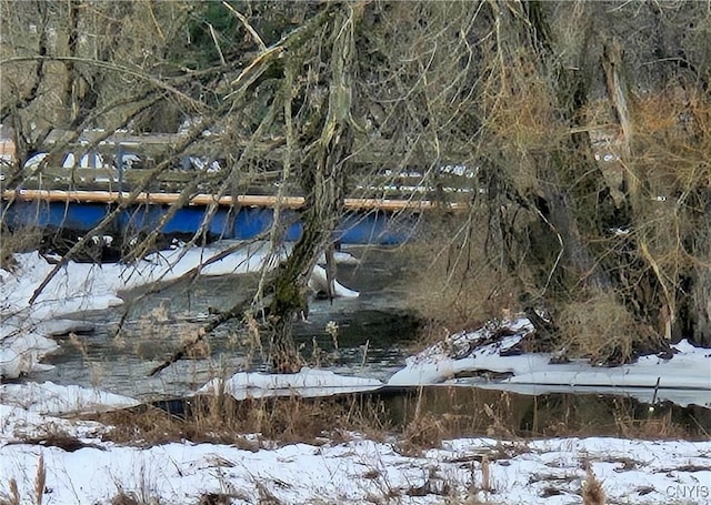 snowy landscape with a water view