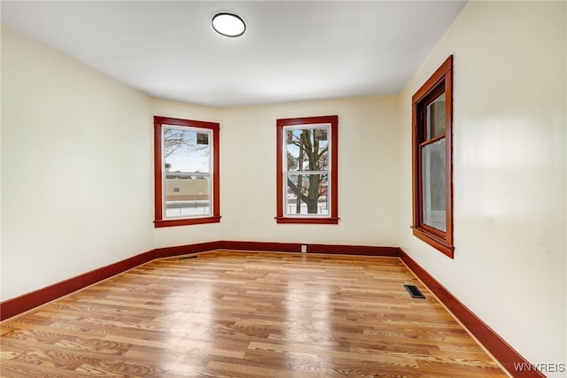 empty room with light wood-type flooring