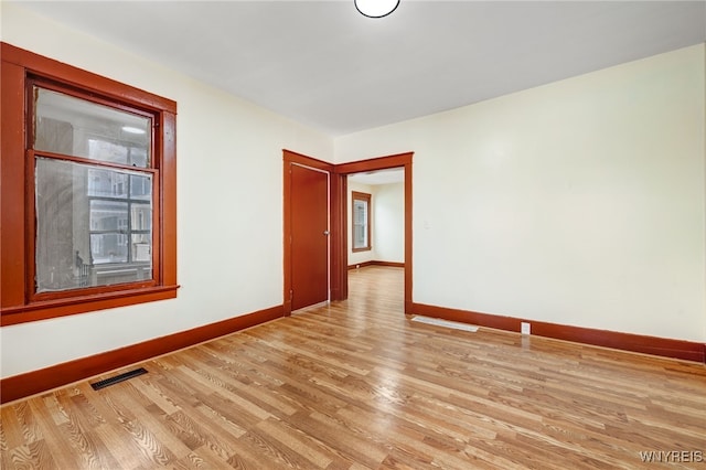 empty room with light wood-type flooring