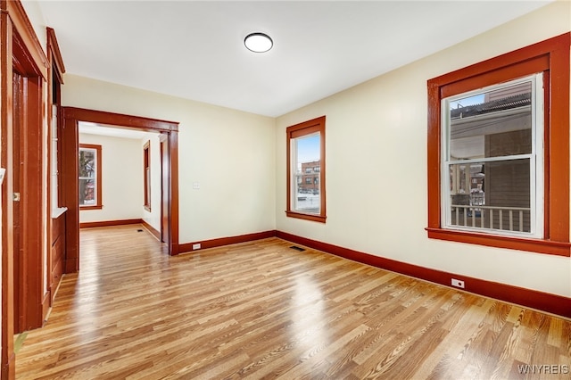 empty room with light wood-type flooring