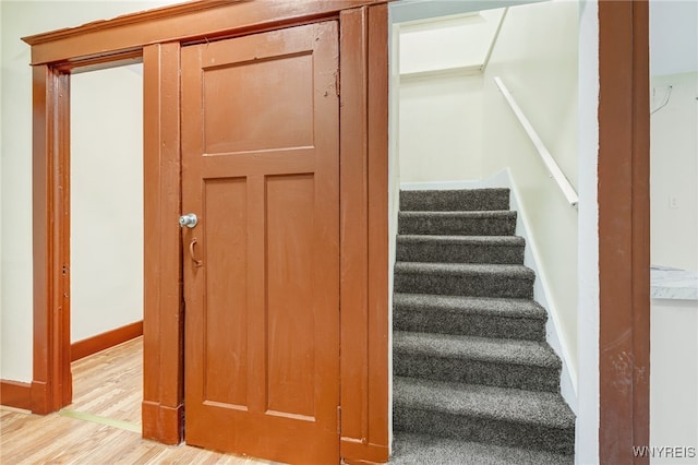 stairs with wood-type flooring