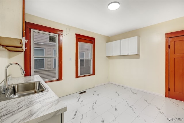 kitchen with sink and white cabinets