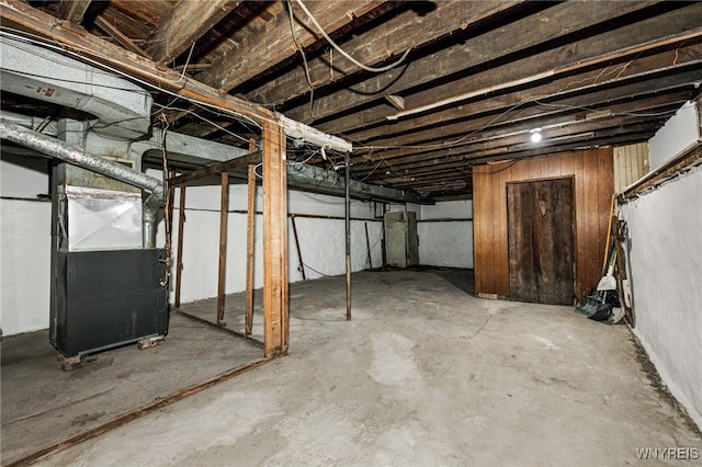 basement featuring heating unit