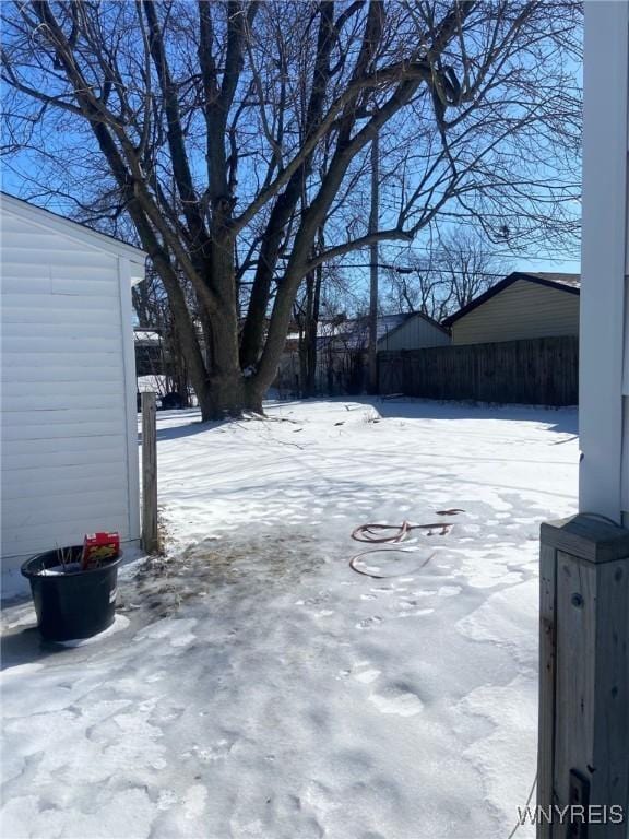 view of yard covered in snow