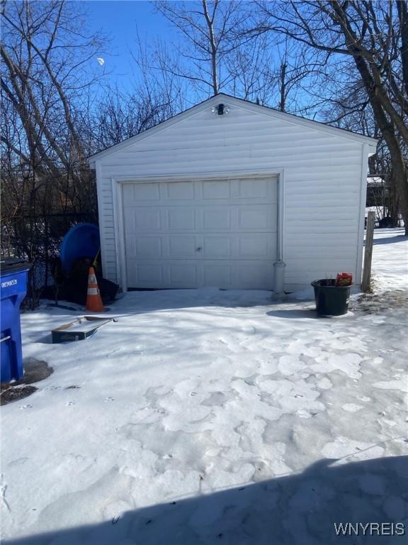 view of snow covered garage