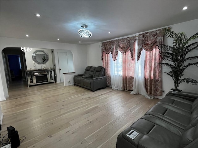 49 Lewis St, Maine, NY 13760 - living room featuring arched walkways, recessed lighting, and light wood-style flooring