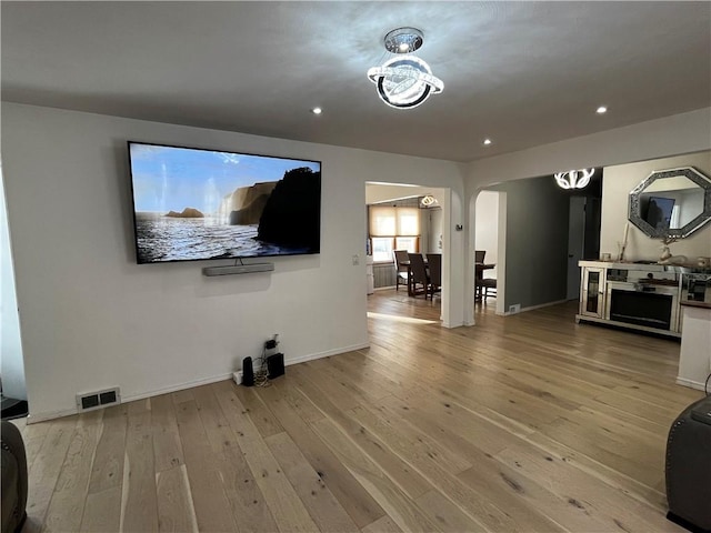 unfurnished living room with wood-type flooring