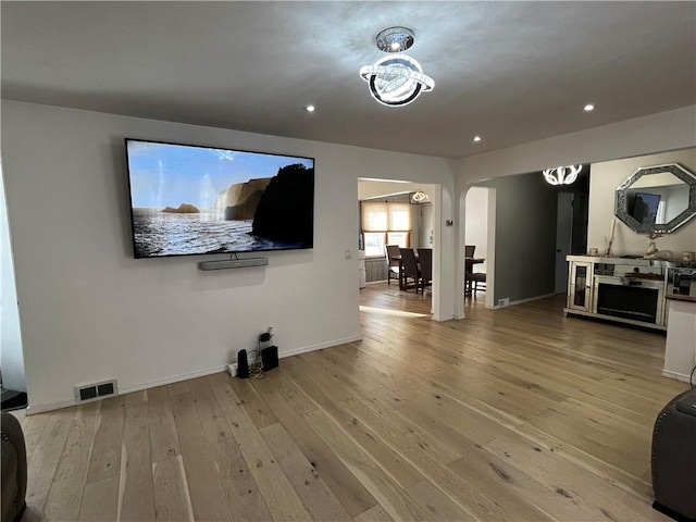 49 Lewis St, Maine, NY 13760 - living room with arched walkways, hardwood / wood-style floors, recessed lighting, and baseboards