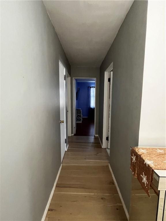 corridor featuring hardwood / wood-style flooring