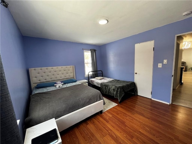 bedroom with hardwood / wood-style floors