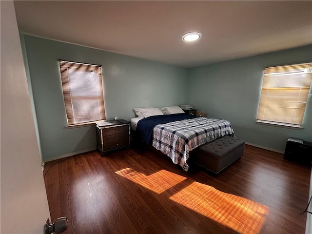 bedroom featuring dark hardwood / wood-style flooring