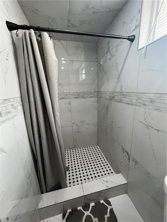 bathroom with a shower with curtain