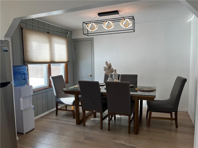 dining space featuring wood-type flooring