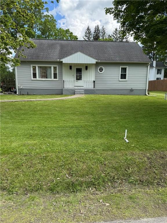 49 Lewis St, Maine, NY 13760 - view of front facade with a shingled roof