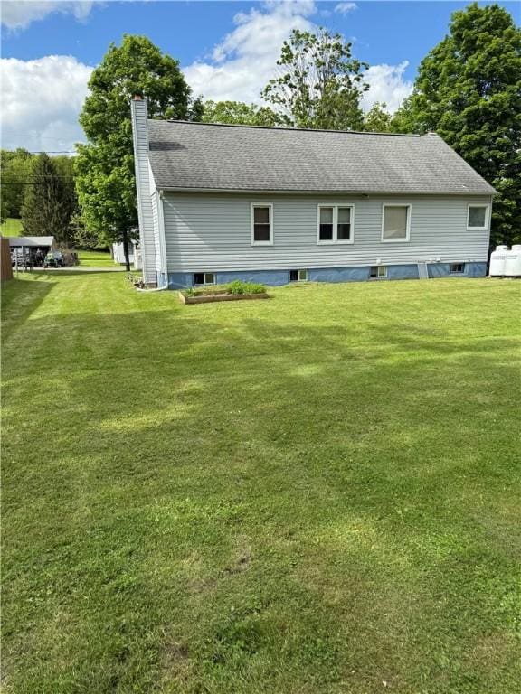 49 Lewis St, Maine, NY 13760 - rear view of house with a chimney and a yard