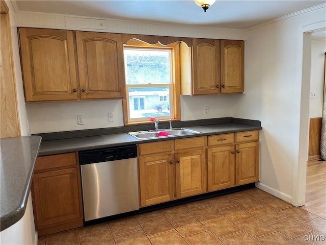 kitchen with tile patterned flooring, sink, ornamental molding, and stainless steel dishwasher