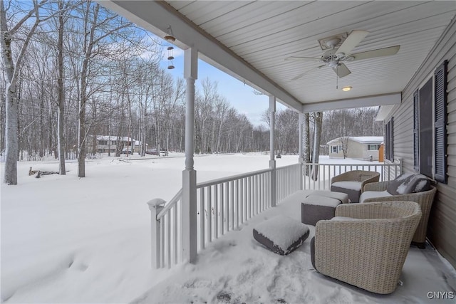 snow covered deck with ceiling fan