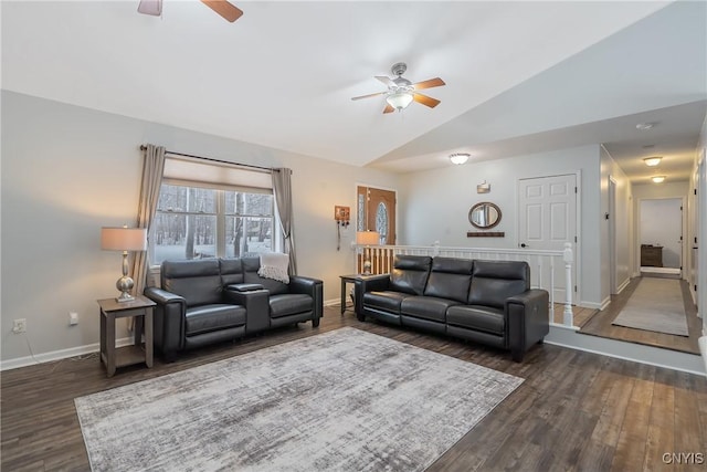 living room featuring ceiling fan, lofted ceiling, and dark hardwood / wood-style flooring