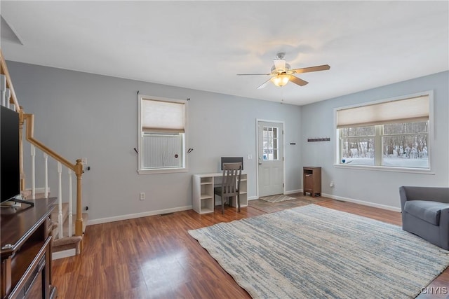 living room featuring dark hardwood / wood-style flooring and ceiling fan