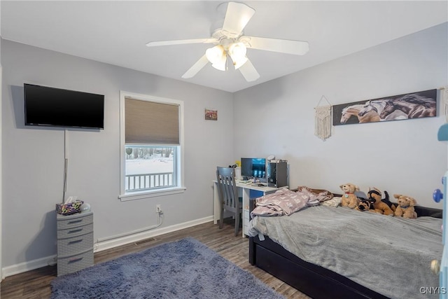 bedroom featuring dark hardwood / wood-style flooring and ceiling fan