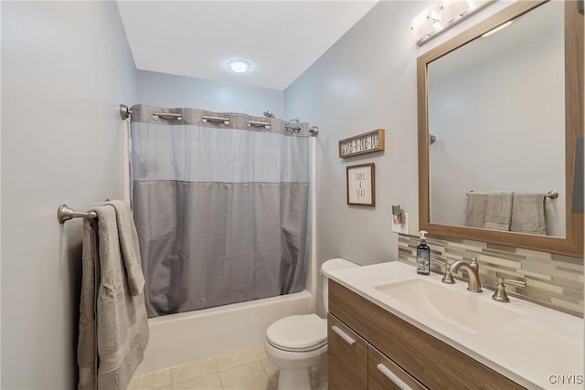 full bathroom featuring toilet, vanity, shower / bath combo, tile patterned flooring, and decorative backsplash