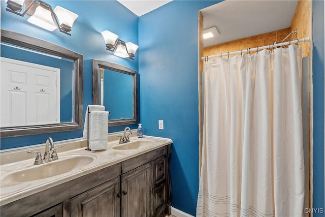 bathroom with vanity and a shower with shower curtain