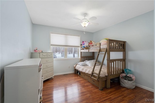 bedroom with ceiling fan and dark hardwood / wood-style flooring