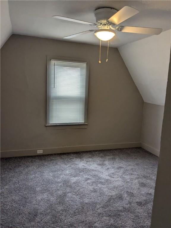 bonus room with lofted ceiling, carpet, baseboards, and a ceiling fan