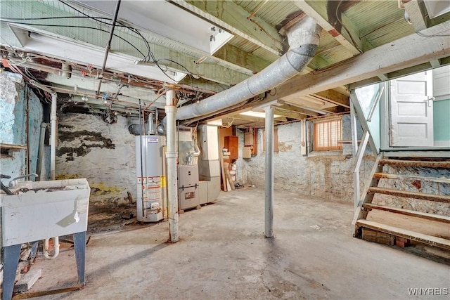 basement featuring heating unit and gas water heater