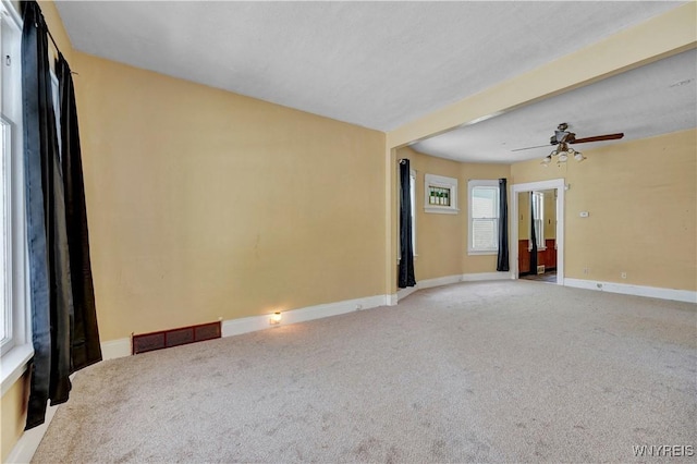 carpeted empty room with ceiling fan