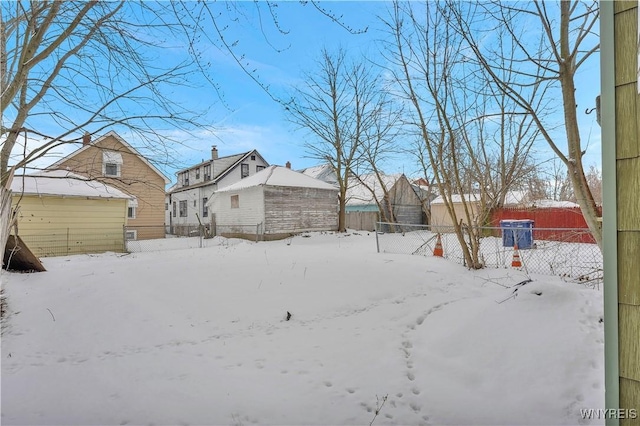 view of yard layered in snow