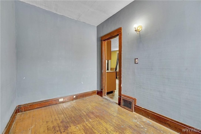 unfurnished room featuring light wood-type flooring