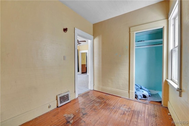 unfurnished bedroom featuring hardwood / wood-style flooring