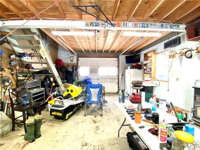 garage featuring white fridge