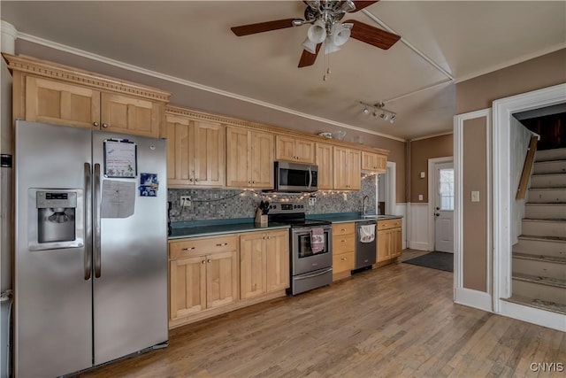 kitchen featuring backsplash, stainless steel appliances, ornamental molding, light hardwood / wood-style floors, and light brown cabinets