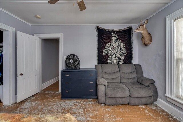 sitting room with crown molding, ceiling fan, and hardwood / wood-style floors