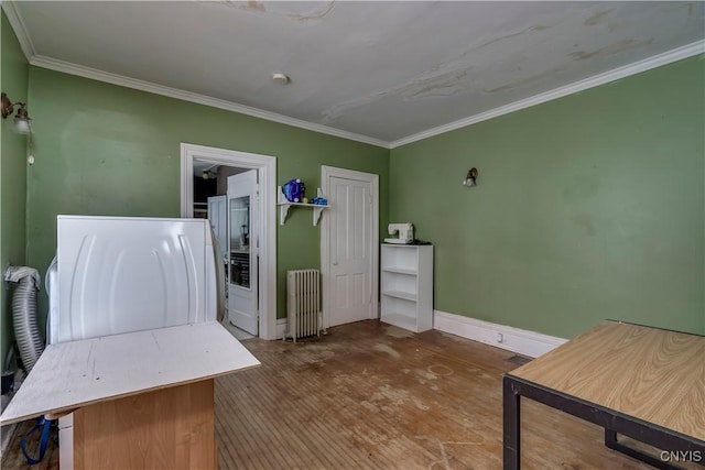 interior space with crown molding, wood-type flooring, and radiator