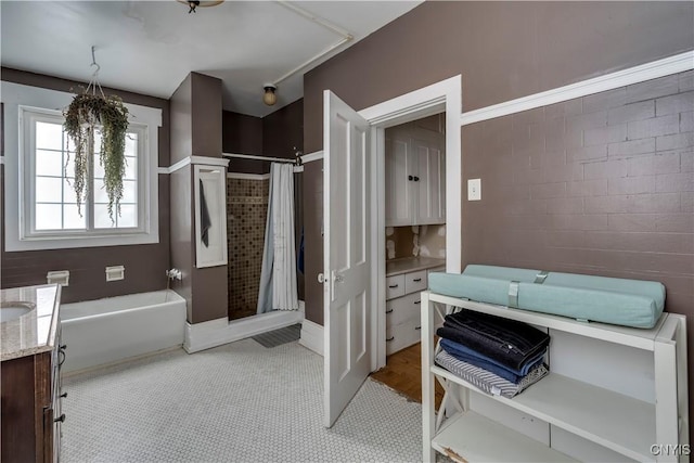 bathroom featuring independent shower and bath and vanity