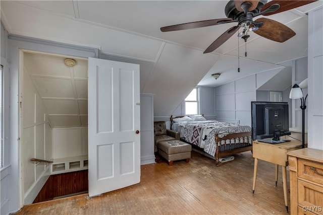 bedroom featuring light hardwood / wood-style floors and vaulted ceiling